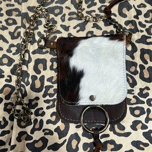 Canoe cowhide shoulder bag